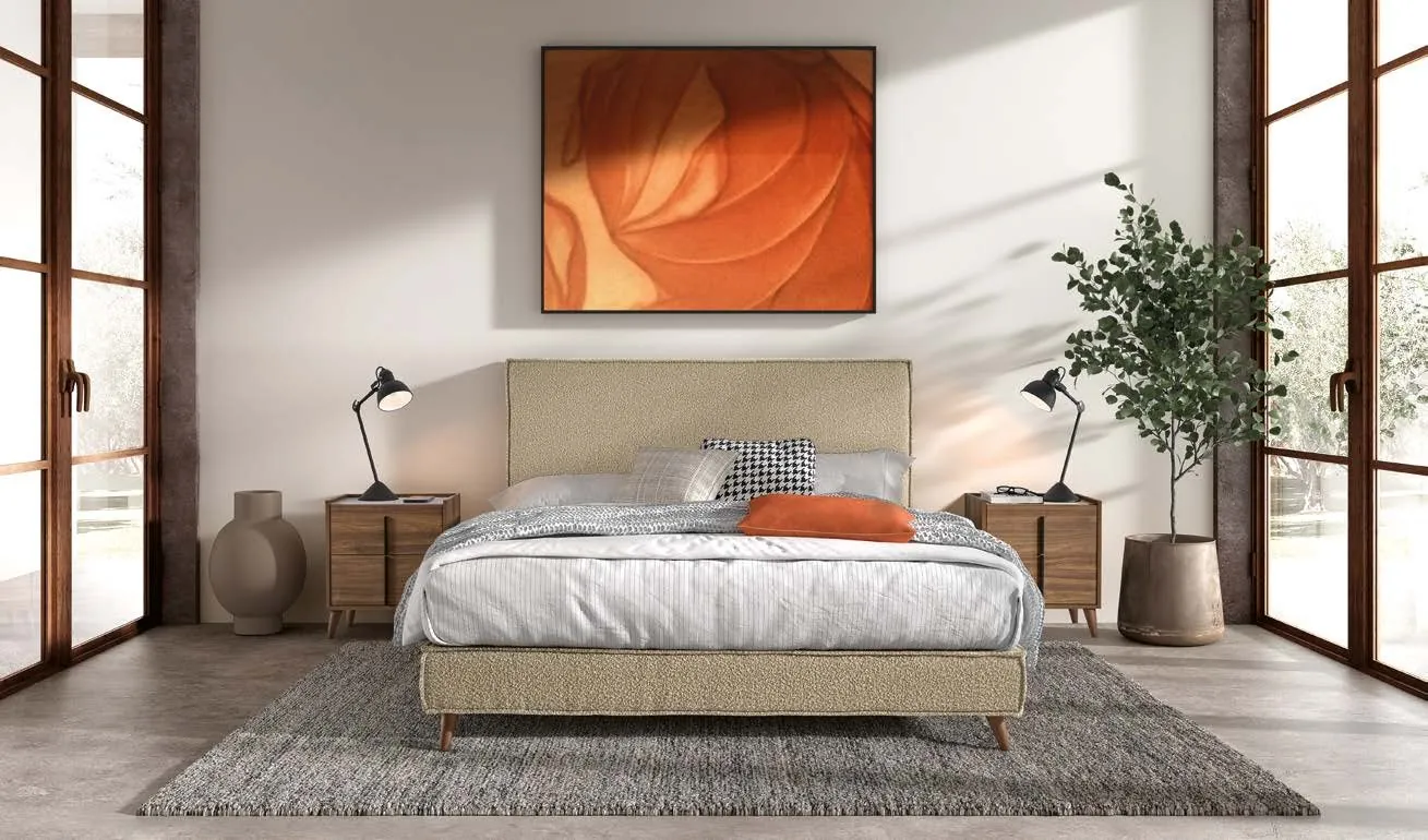 Sommiers tapissiers : lit tapissé beige sur pieds bois avec tête de lit assortie dans une chambre lumineuse